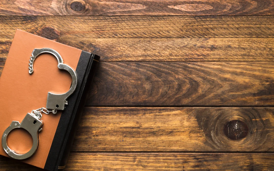 handcuffs on a book